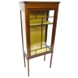 An Edwardian mahogany and boxwood strung display cabinet, with single glazed door, on square