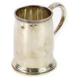 A George VI plain silver Christening mug, with reeded band, shaped handle and heart shaped thumb