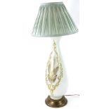 A Continental white opaque glass lamp base, decorated with wheat within a gilt cartouche on a