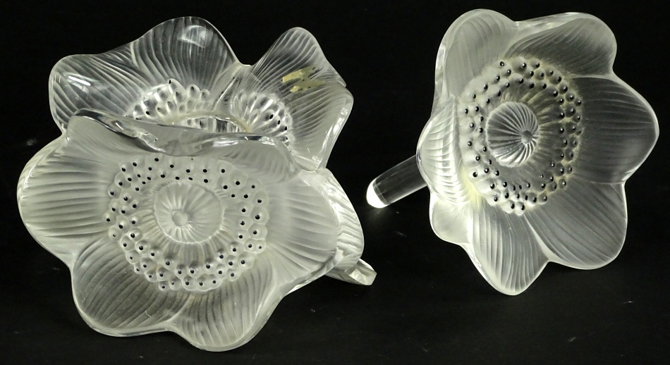 A Lalique glass candlestick, modelled in the form of three anenomies, stamped Lalique France, 12cm W