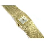 A 9ct gold Accurist ladies wristwatch, with articulated design bracelet, of five row square