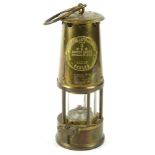 A brass protector miners lamp, with original plaque etc., type 6, 23cm H.