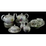 A Hutschenreuther Dresden porcelain part tea service, to include two teapots, muffin dish and cover,
