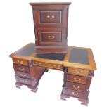 A mahogany pedestal desk, the hour glass shaped top with three black leatherette insets, above three