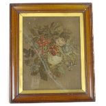 A 19thC wool work picture, embroidered with flower spray and a thin linen backing 28cm x 21cm.