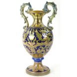 An Italian Robbi Gualdo lustre two handled vase, decoration in rococo style with griffins, foliate