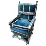 A late 19th/early 20thC velvet covered Savonarola type chair, with turned finials, various tasselled