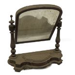 A Victorian mahogany dressing table mirror, with turned supports, arched plate, serpentine base with