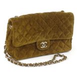 A 1990s Chanel quilted suede bag, in brown, with interlinked CC clasp and chain handle, serial