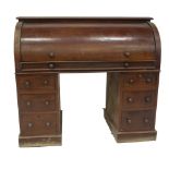 A Victorian mahogany cylinder top estate desk, with a bird's eye maple veneered interior with