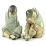 A pair of Lladro porcelain figures, each modelled in the form of an Eskimo or Inuit girl, 27cm H and