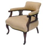 A late Victorian walnut tub shaped chair, the padded back and seat upholstered in gold damask type