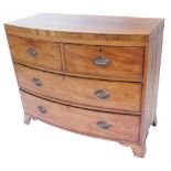 An early 19thC mahogany bow fronted chest, with two short and two long drawers, on splay feet,