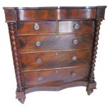 A Victorian mahogany Scottish type large chest of drawers, the serpentine fronted top with a