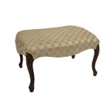A 19thC serpentine stool, with later brocade upholstery, on carved and channelled cabriole legs with