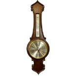 A mahogany wheel shaped barometer by Comitti of London, with silver dial etc., 71cm L.