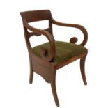 A Regency mahogany carver chair, with flame veneered inset cresting rail, shell carved bar back,