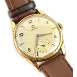 An Omega 9ct gold gent's wristwatch, with circular watch head, and painted cream dial, with