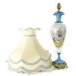A late 19thC Sevres style porcelain lamp base, painted with French style figures, on a white ground,