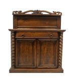A William IV rosewood chiffonier, with scroll and open carved raised panel back with shelf, 'D'