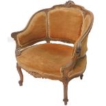A late 19th/early 20thC French walnut tub shaped armchair, the showframe carved with scrolls, leaves