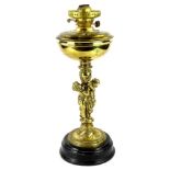 A 20thC brass oil lamp, with figural column and ebonised base, 49cm H.