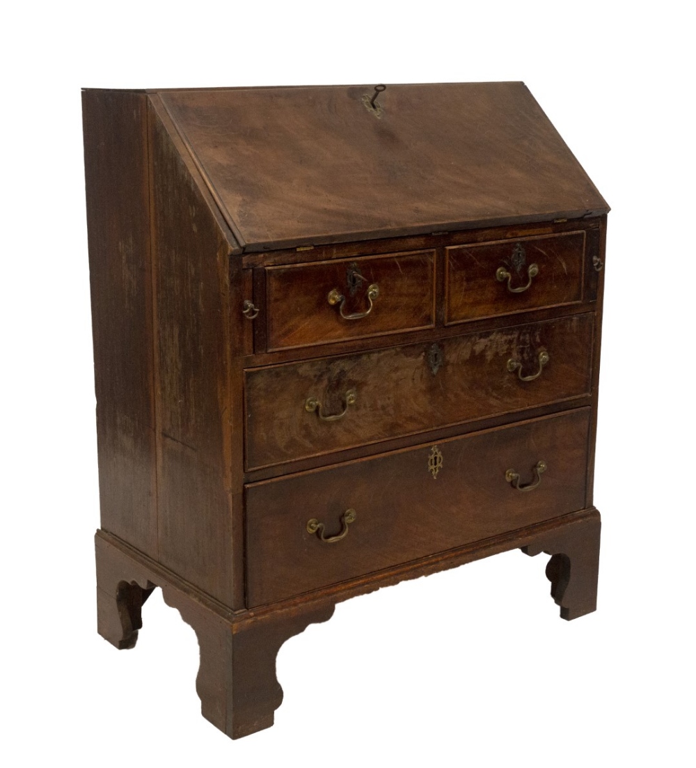 A George II walnut bureau, with flame veneered fall flap resting on lopers, revealing a fitted