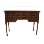 A George III style mahogany serpentine sideboard, with plain top and an arrangement of five