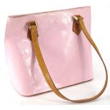 A Louis Vuitton Vernis shoulder bag, in patent pink leather with tan leather handles.