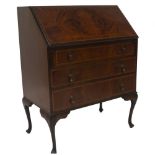 An Edwardian flamed mahogany bureau, with rosewood cross banded fall flap revealing a fitted