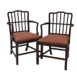 A set of six George III mahogany gate back dining chairs, including two carvers, having wavy