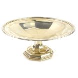 A George V silver centre piece or tazza with faceted decoration on a domed foot, by Mappin and Webb,