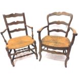 Two 19thC continental country made armchairs, each with a shaped ladder back a rush seat etc. (AF)