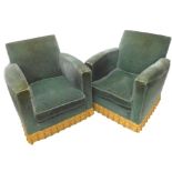 A pair of Art Deco armchairs, each with gold coloured fringe to base.
