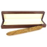 A hand rolled cigar, 20cm L.Provenance: By family repute given to the vendors father by Winston