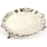 A George IV silver waiter, with a piecrust border, engraved centrally with a partly vacant cartouche