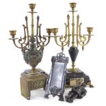 A pair of French black slate and marble three branch candelabra, carved wooden figure of a soldier