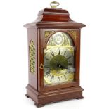 A late 19th/early 20thC mahogany mantel clock, the arched dial signed EJ Goodfellow, Waybridge, with