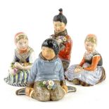 Four Royal Copenhagen & Carl Martin Hansen porcelain figures; Greenland Boy number 12419, 10am,