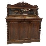 A early Victorian flame mahogany chiffionier, with scroll and mirror back, shaped shelf on scroll