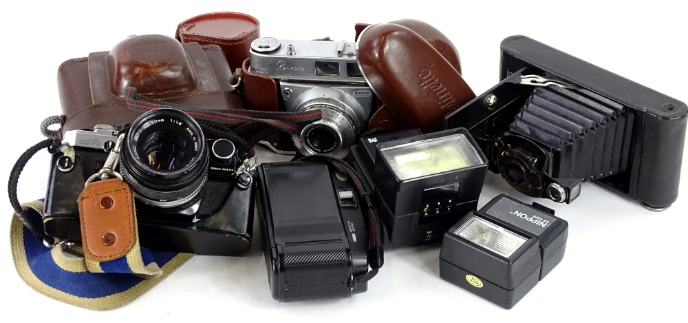 A quantity of cameras, to include Kodak, Retinette, Olympus OM10 with lens etc.