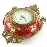 A late 19th/early 20thC French hanging Cartel type timepiece, the red ceramic case decorated in gilt