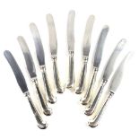 A set of nine Victorian silver pistol handled table knives, the stainless blades engraved Goldsmiths