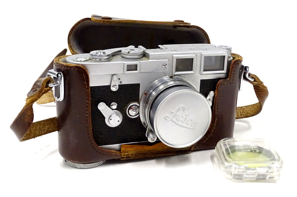 A vintage Leica Ernst Leitz camera, M3-857092, in brown leather case with Summicron f=5cm1:2 lens,