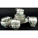 A Crown Staffordshire porcelain part tea service, printed and painted in famille vert enamels with