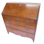 An early 19thC mahogany boxwood and ebony strung bureau, the fall enclosing a fitted interior with