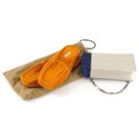 A pair of Hermes size 38 leather slippers, with travelling bag, and a ladies handbag.