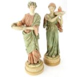A pair of Royal Dux porcelain figures, each modelled in the form of a Roman Emperor and a lady