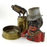 A cast iron novelty money box, modelled in the form of a gentleman wearing a hat, a Swedish brass