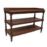 A Victorian mahogany buffet, with tray top and three levels divided by turned uprights and turned